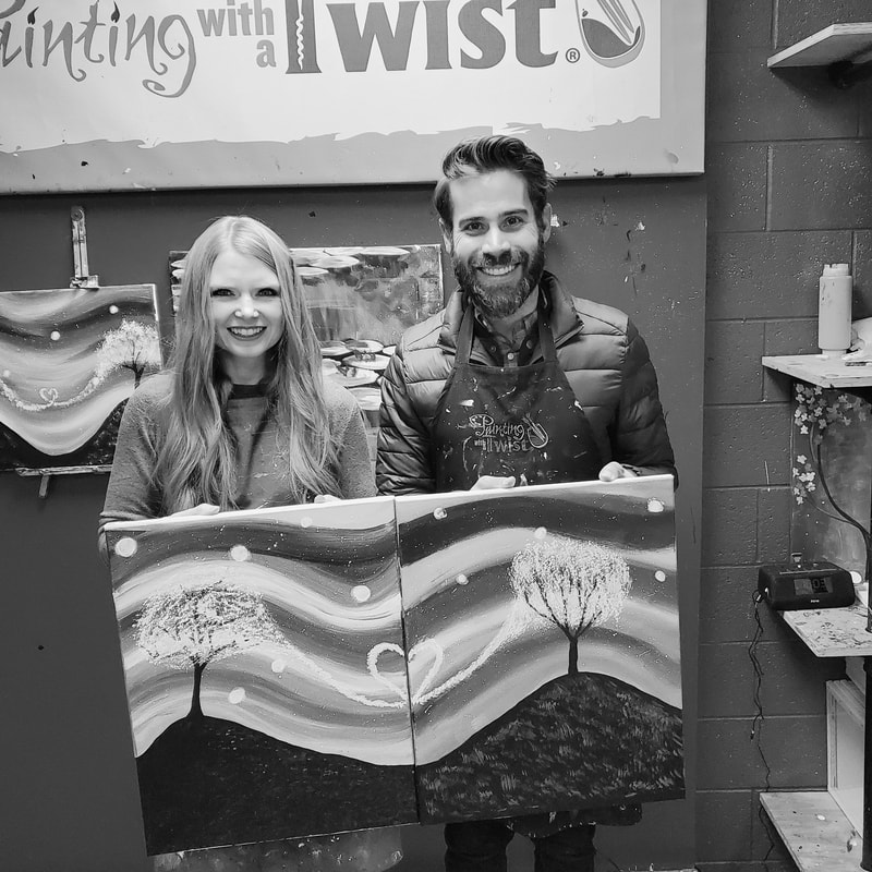 Kyle Evans painting with his wife